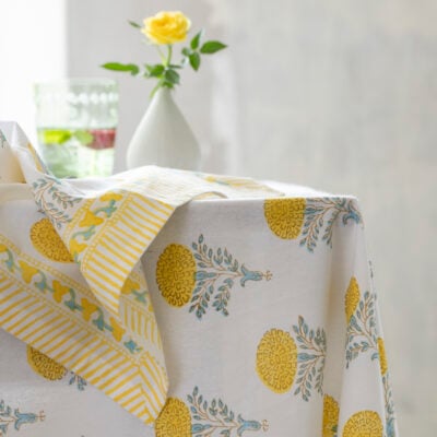 Lemon Cotton Hand Block Print Tablecloth | Lemon Cotton Hand Block Print Napkin | Stem Vases Asst Designs | Champagne Flute Etched in Green & Clear | Rustic Scalloped Pillar Candle Lemon